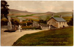 View towards Wayside with side view of village sign